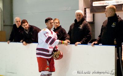 Captain Joe Johnstone Shakes Hands with Coaching Staff
