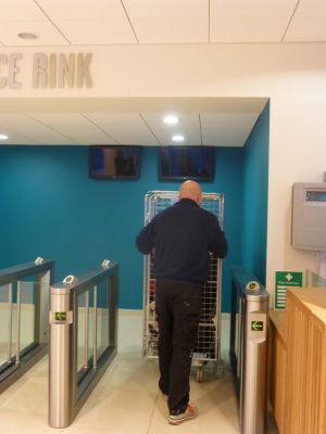 Hockey Equipment Arriving Through Ice Turnstiles
