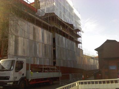 Bus Garage Scaffolding Covered
