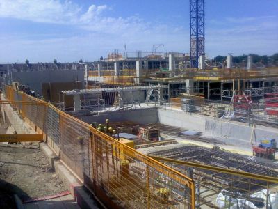 Swimming Pool Tank (Foreground), Rear Wall of Sports Hall (Back Left), Plant Rooms/Gym Pillars (Back Right)
